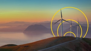 Foto de tres turbinas eólicas en una colina con un esquema del gráfico Lograr cero emisiones netas