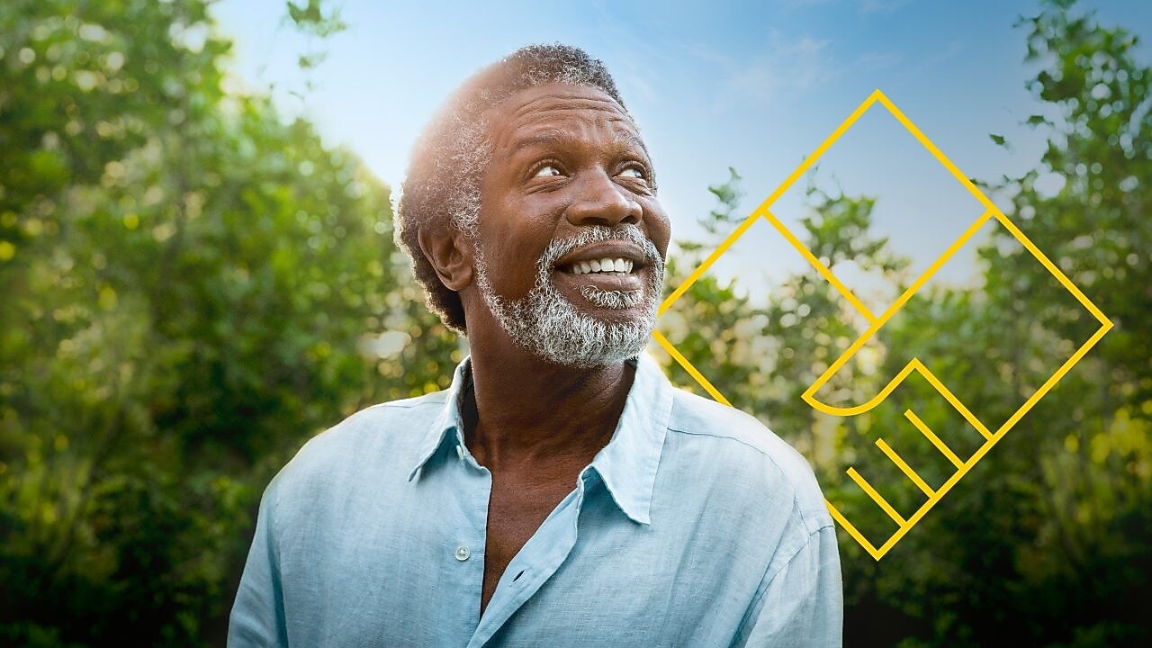 Smiling man with a beard in front of trees with an outline of the Generating shareholder value graph